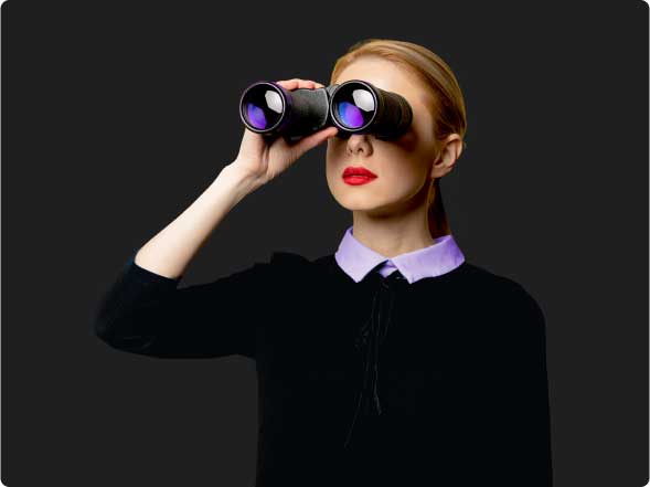 Women looking through binoculars Women looking through binoculars