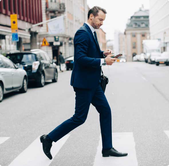 man walking on the cross walk